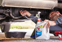 Load image into Gallery viewer, In this example of how to use the Gallon Bottle Fluid Pump, the pump is being used to change the rear differential fluid on a Jeep Wrangler.
